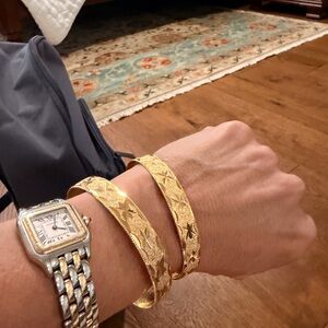 Gold plated bronze inside bracelets 
Two